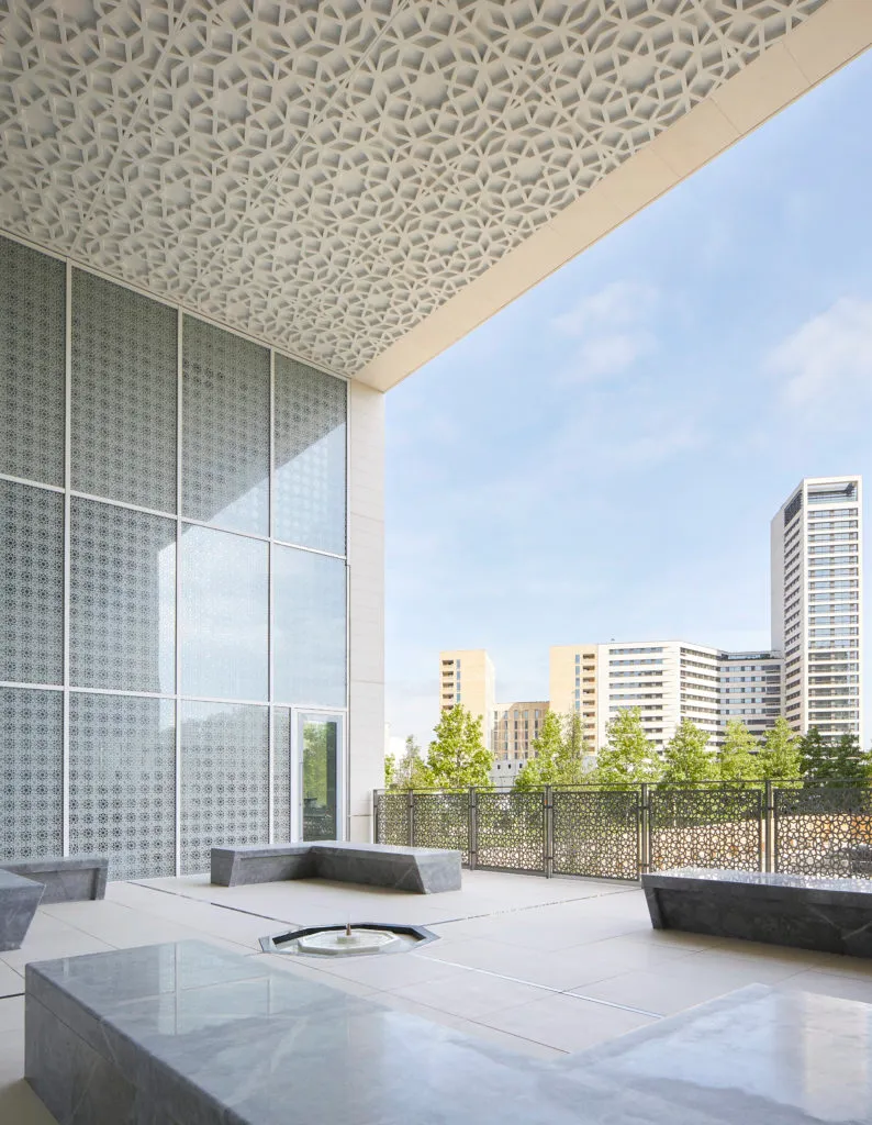 A view looking out from the marble Garden of Tranquillity to the buildings beyond