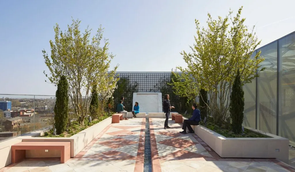 Three people exploring the Garden of Life, an Indian-inspired Islamic Garden.